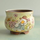 Ceramic cup with a cartoon duck design on a light background
