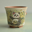 Ceramic cup with a panda design on a gradient background