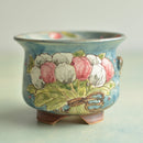 Decorative ceramic bowl with floral design on a light background