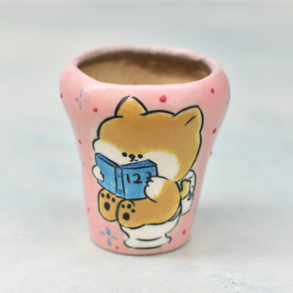 Hand Painted Pink Ceramic Succulent Pot with Dog on Toilet Approximately 2"
